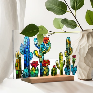 Close-up of artistic cactus acrylic desktop decor with colorful mosaic pattern and wood base