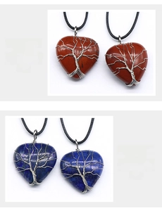 Detailed view of 30mm wire wrapped heart tree of life pendants in rainbow stone and lapis lazuli