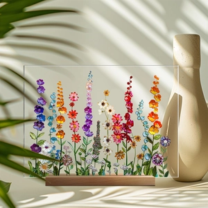 Macro shot of rectangular acrylic floral ornament with wooden base and vibrant patterns