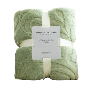 Green embossed flannel blanket tied with a white silk gift ribbon for home use