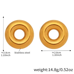 Detail view of 2.8cm hollow donut earrings in polished golden stainless steel