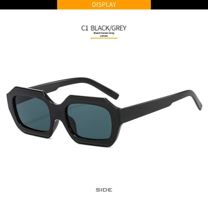 Detail view of model C1 polygon sunglasses with black frames and grey lenses side profile