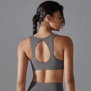 Detail of grey sports bra featuring water-drop back cutout and seamless elastic fabric