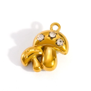 Macro shot of a 18k gold plated mushroom pendant featuring three sparkling rhinestones