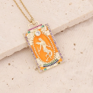 Macro view of The World tarot card pendant with golden frame and colorful gemstones