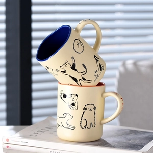 Cute cream-colored ceramic cat and dog coffee mugs with vibrant inner lining