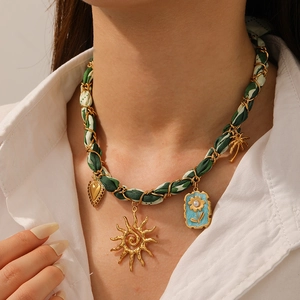 French vintage necklace with green ribbon chain and gold sunflower heart charms