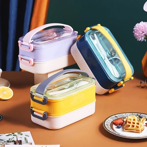 Three variants of double-layer stainless steel bento boxes with cutlery and handles