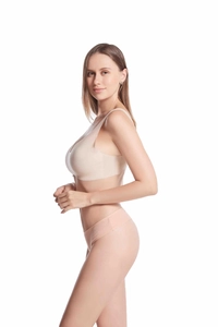 Side view of seamless beige cotton thong and wireless bra set for women