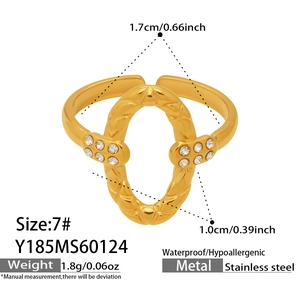 Detailed view of an oval quilted ring in stainless steel with tiny zircon stones