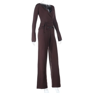 Detail of dark brown knitted two-piece set featuring a V-neck wrap top and wide-leg pants