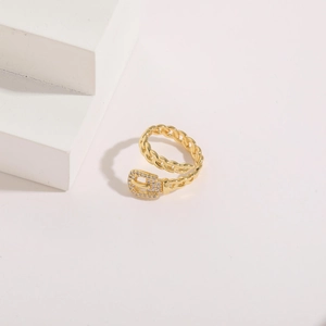 Detail of 14K gold plated buckle ring with shimmering cubic zirconia micro-pave setting