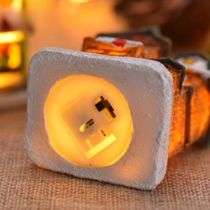 Christmas glowing resin miniature house with warm light switch and snowy base detail