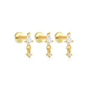 Detailed view of three gold S925 sterling silver stud earrings with sparkling cubic zirconia