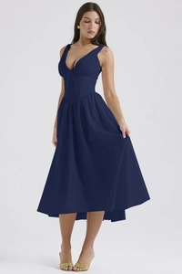 Detail view of the V-neck bodice and slim-fit waist on this navy blue midi dress