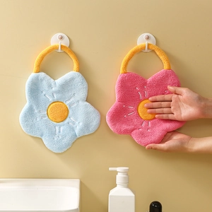 Detail of soft coral fleece hand towels in blue and rose pink flower shapes with hanging loop