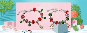 Detailed view of Christmas themed DIY charm bracelet with snowflake and tree pendants