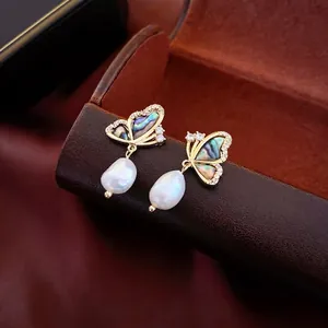 Gold-plated butterfly earrings with natural freshwater pearls and shell inlay accents