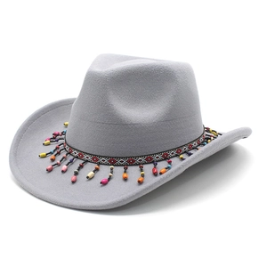 Detail of grey felt cowboy hat featuring colorful ethnic style beaded trim and rolled brim