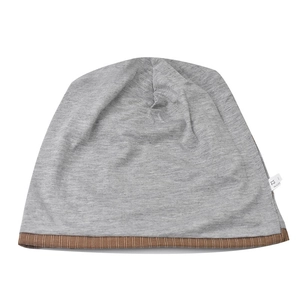 Detail view of cotton grey beanie showing high-density knit texture and striped cuff edge