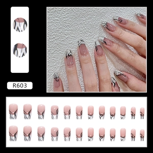 Long coffin press-on nails with pink base, white French tips, and black zebra patterns
