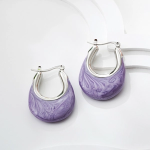 Detail of silver U-shaped hoop earrings with purple marble enamel on minimalist stone