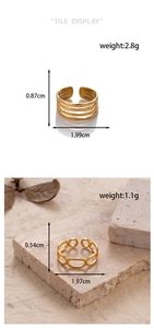 Detail showing two gold plated adjustable rings with a multi-layered and chain link design