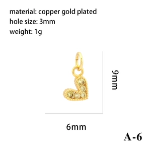 Detailed view of 18K gold-plated copper heart pendant with yellow zircons and 9x6mm size