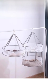 Detail of hanging mesh laundry baskets for drying delicate sweaters and socks