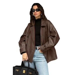 Loose fit brown faux leather blazer jacket for women paired with denim pants