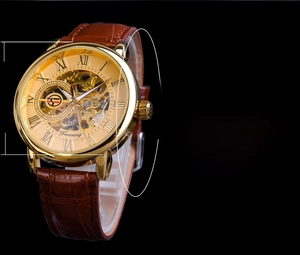 Skeleton mechanical watch specs with 41mm gold case and brown leather strap on black background