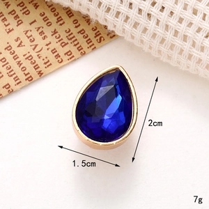 Macro shot of 2cm blue teardrop gemstone charm with dimensions and weight info
