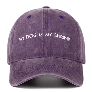 Close-up of MY DOG IS MY SHRINK embroidery on washed purple distressed baseball cap