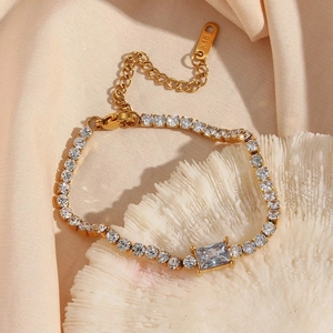 Detail of 18k gold plated tennis bracelet with square zircon and K18 engraving