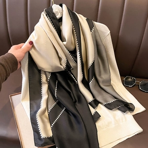 Luxurious tricolor silk-like scarf with diamond pattern and camellia brooch accent