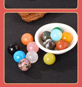 Macro shot of assorted 20mm natural crystal spheres in a ceramic bowl and dark background