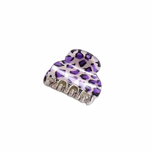 Detailed view of small leopard print hair claw clip in purple with durable metal spring