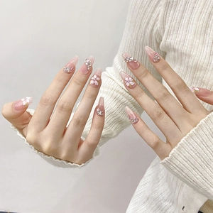 Handmade press-on nails with 3D cherry blossom floral art and sparkling rhinestones