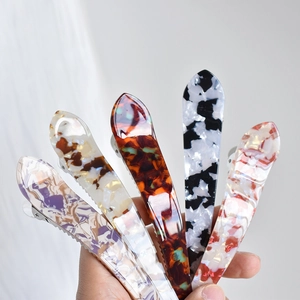 Set of five large acetate shark hair claws with elegant marble patterns for thick hair