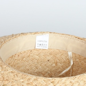 Detail showing 100% natural raffia straw material and internal sweatband on sun hat