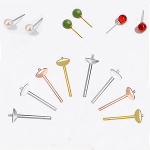 Macro view of S925 sterling silver earring studs in silver, gold, and rose gold finishes