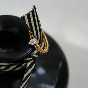 Chain style 18K gold plated titanium steel ring with a pear cut zircon stone