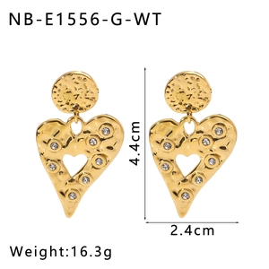 Detailed view of gold lava-textured heart earrings with cubic zirconia, 4.4cm length