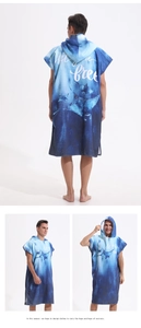 Multiple views of blue microfiber hooded beach poncho featuring manta ray prints