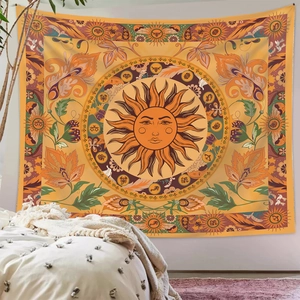 Detail view of Bohemian sun tapestry with zodiac signs hung in a cozy modern bedroom