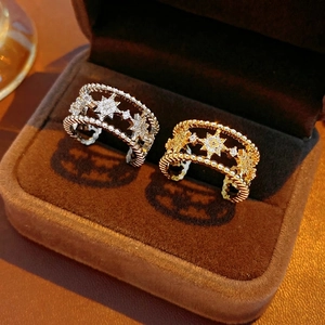 Double-layered star hollow open ring with cubic zirconia in gold and silver finish