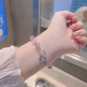Pink opal crystal butterfly stretch bracelet with silver bow charm for women on wrist