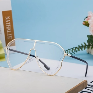 Oversized irregular wave cut sunglasses with gold metal bridge and black temples