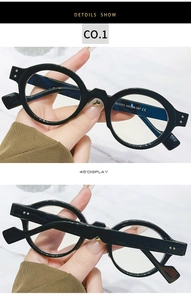 Detail view of glossy black vintage round eyeglass frames with CE certification mark