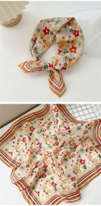 Detail of floral cotton linen neck scarf showing knotted style and folded texture